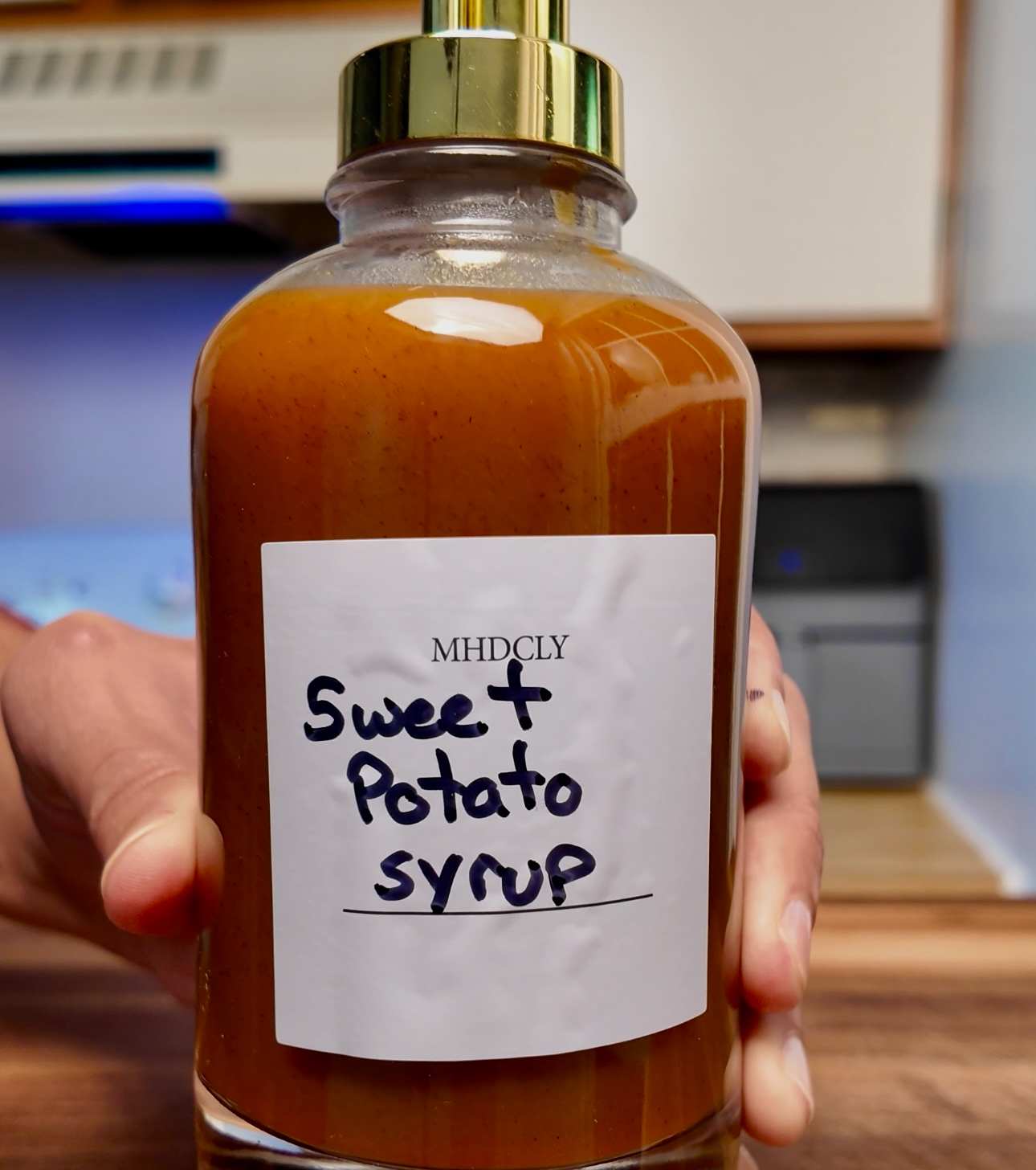 sweet potato syrup in a glass dispenser