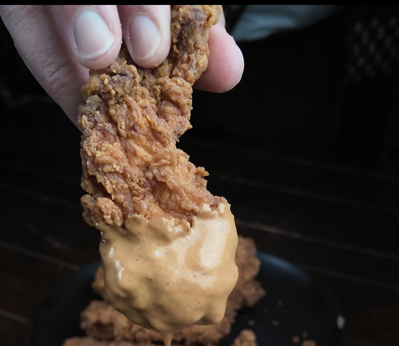 Chicken strips dipped in sauce